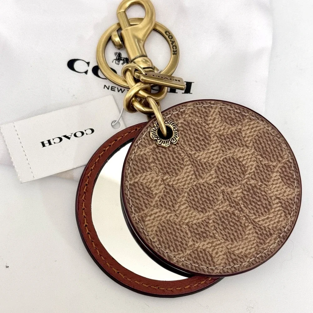 Coach round mirror